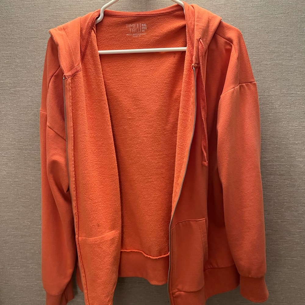orange zip up sweater